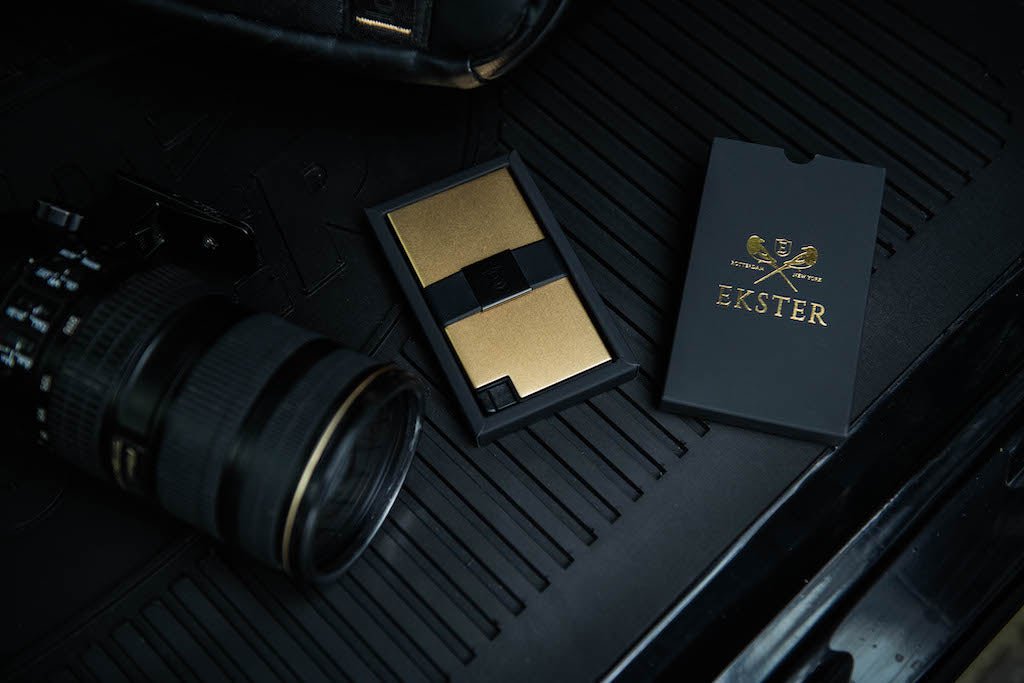 18k Gold cardholder show in car with camera next to it