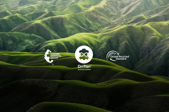 Mountain backdrop with DriTan, Leather Working Group and Global Recycled Standard logos