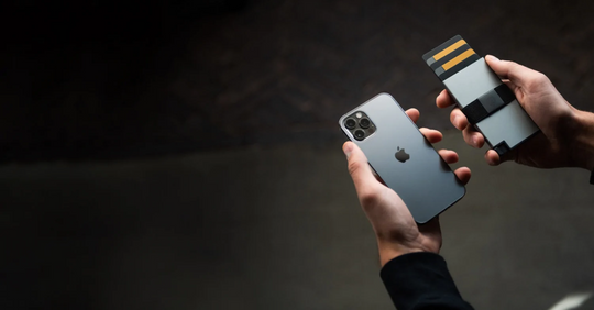 Person holding RFID blocking aluminum cardholder iPhone