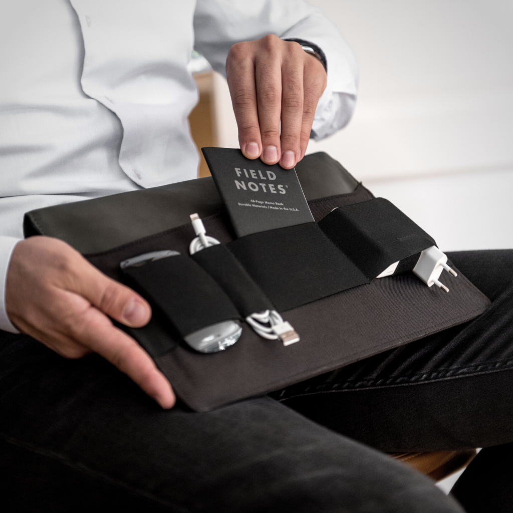 Ekster laptop cover with pockets for charger, mouse, and pens