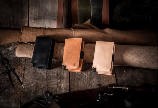 three slim leather smart wallets side by side