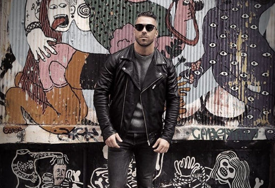 man in leather jacket and glasses