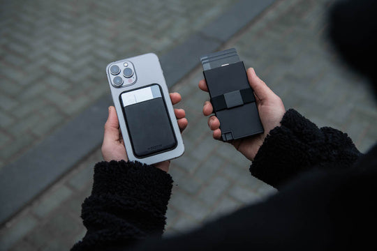 Person holding iPhone with MagSafe cardholder  and RFID blocking aluminum cardholder