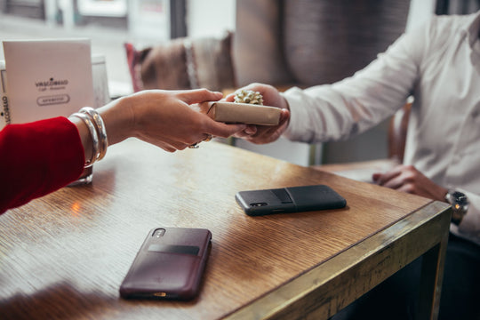 man receiving a smart wallet as a gift