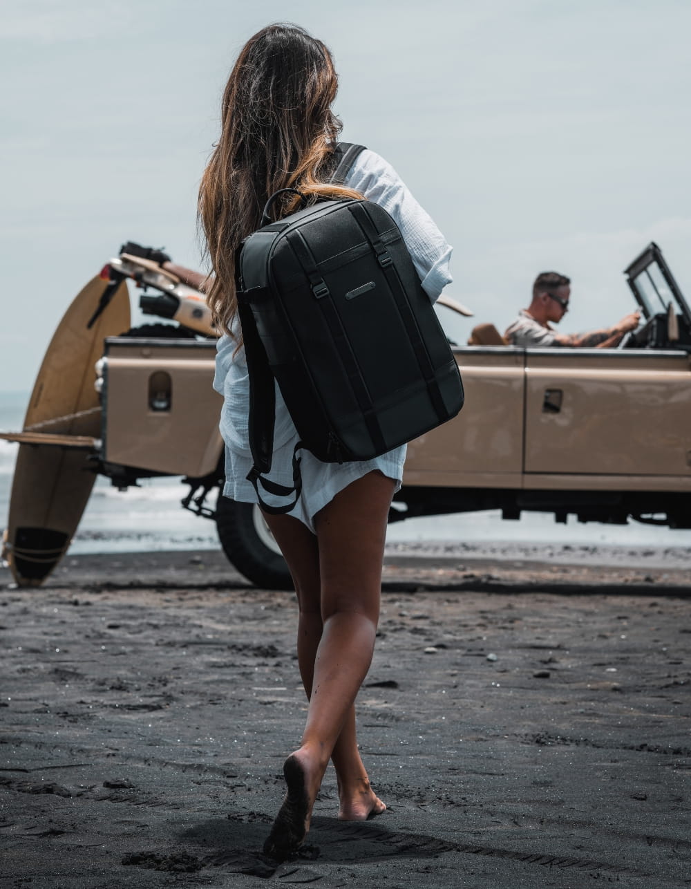 Woman carrying GRID Backpack on summer vacation