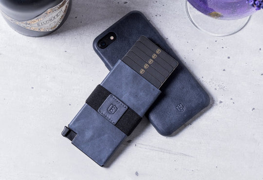 blue leather slim wallet and iphone