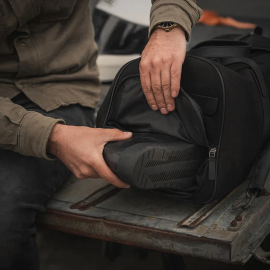 Weekender Duffle Bag in action used to add shoes to the bag