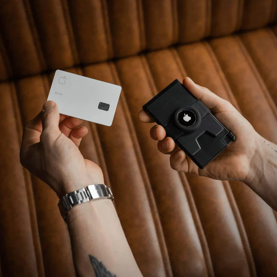 Aluminum Cardholder for airtag held in hand pulling out a credit card