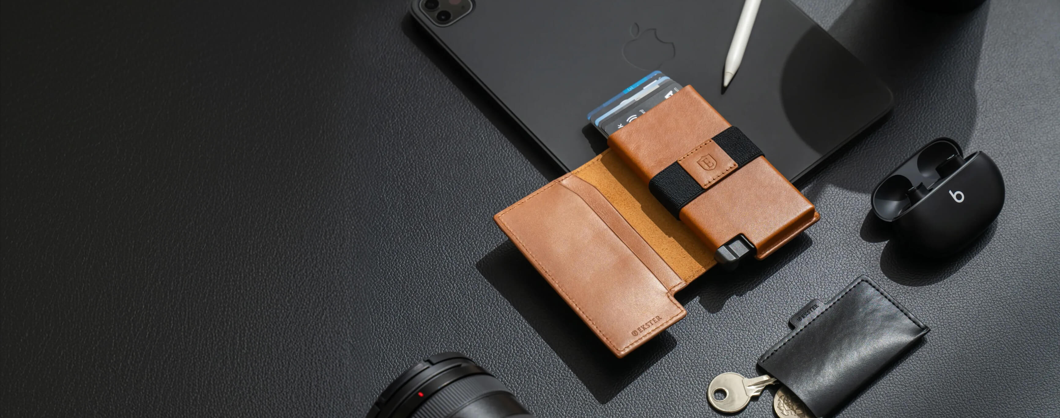 Wallet Pro Tan laying on a table 