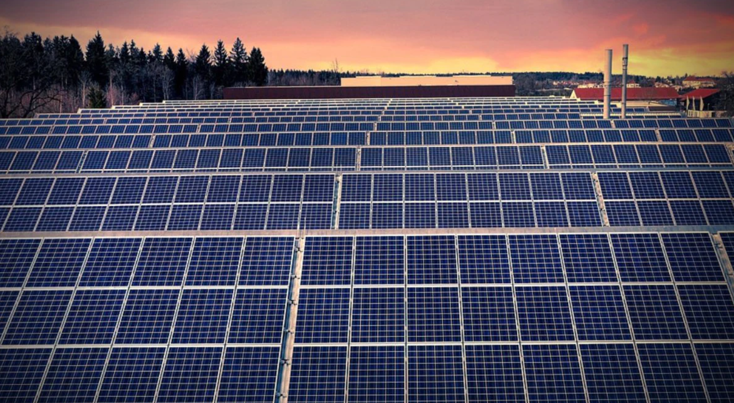 Solar panels set against sun set backdrop