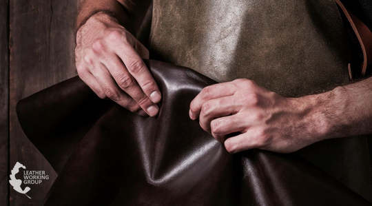 Person holding sheet of leather certified by Leather working group