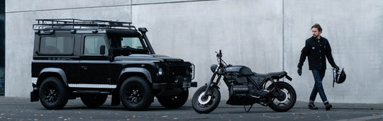 Motor, and defender plus man walking away