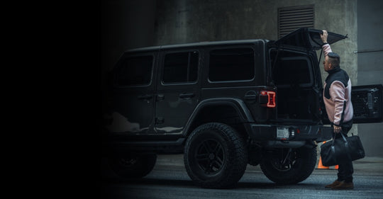 jeep defender with man stepping away