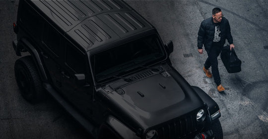 jeep defender with man stepping away