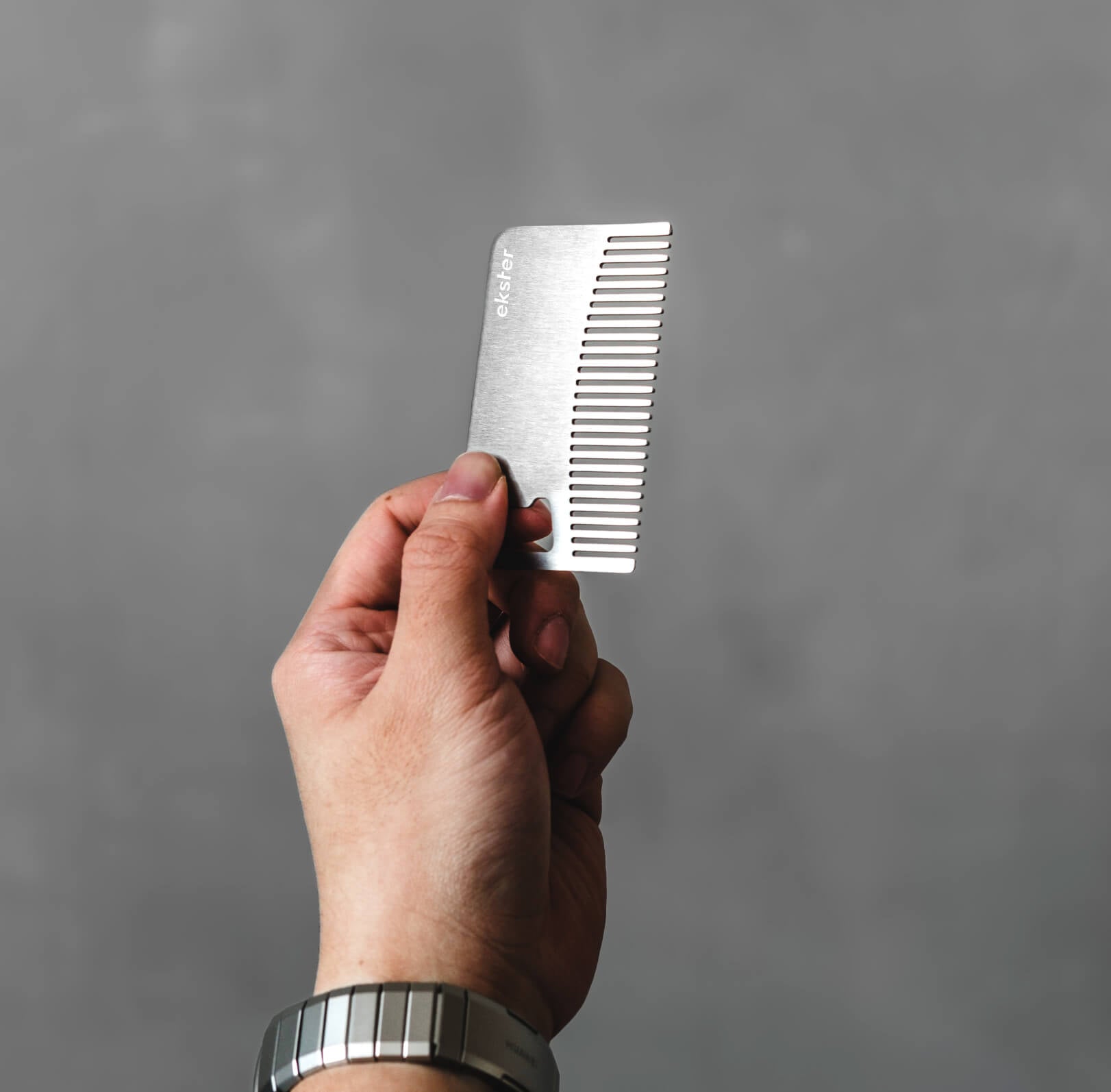 Stainless steel comb and bottle opener